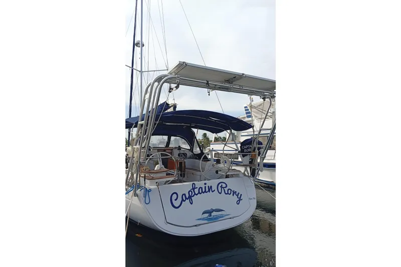  Yacht Photos Pics 2018 Elan Impression 40 sailboat named "Captain Roxy" docked at a marina.