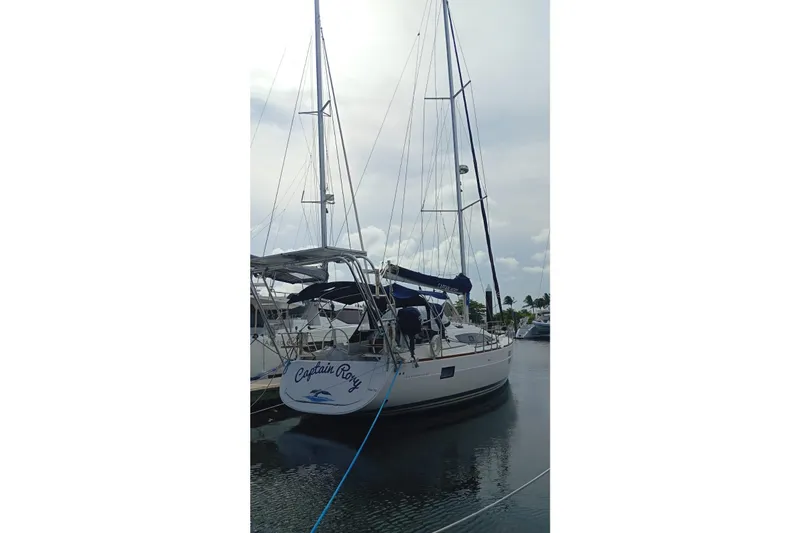  Yacht Photos Pics 2018 Elan Impression 40 sailboat docked, named "Captain Roxy," with clear skies.