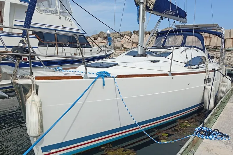  Yacht Photos Pics 2018 Elan Impression 40 sailboat docked at marina, featuring sleek design and blue accents.