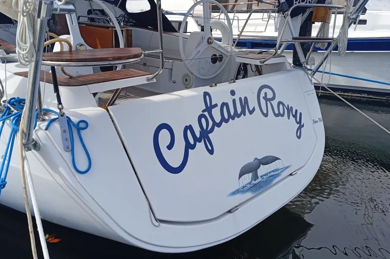  Yacht Photos Pics Sailboat "Captain Rory" docked, Elan Impression 40, 2018 model, with whale graphic.