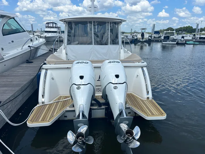  Yacht Photos Pics 2022 Back Cove 34O boat with twin 400 engines docked at marina.
