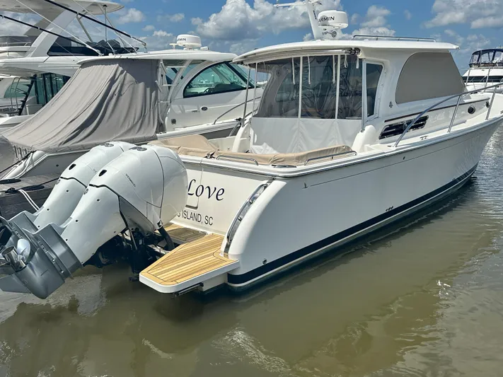  Yacht Photos Pics 2022 Back Cove 34O boat docked, featuring dual outboard engines and sleek design.