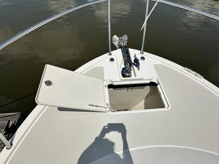  Yacht Photos Pics Bow of 2022 Back Cove 34O boat with open anchor locker and water view.