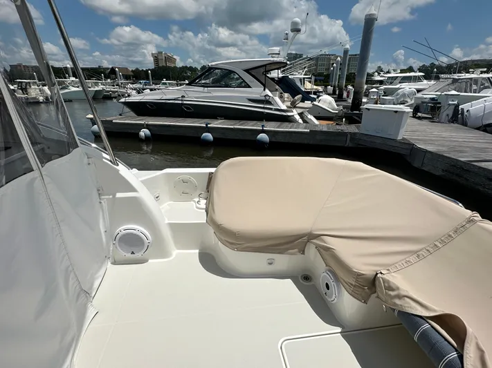  Yacht Photos Pics 2022 Back Cove 34O boat docked at marina under a partly cloudy sky.