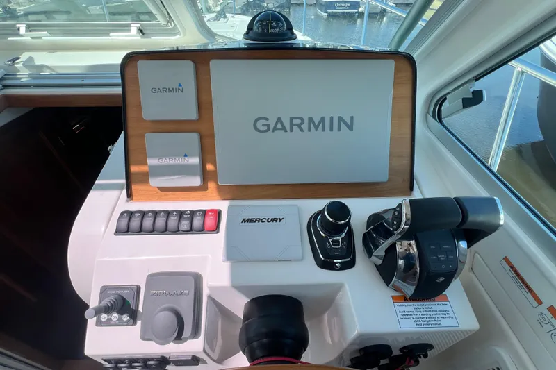  Yacht Photos Pics 2022 Back Cove 34O helm with Garmin navigation and Mercury controls.