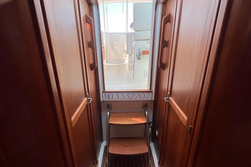  Yacht Photos Pics Interior view of 2022 Back Cove 34O yacht with wooden cabinetry and steps.