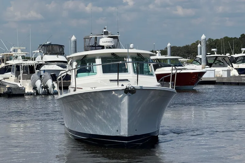  Yacht Photos Pics 2022 Back Cove 34O boat docked at marina, surrounded by other vessels.