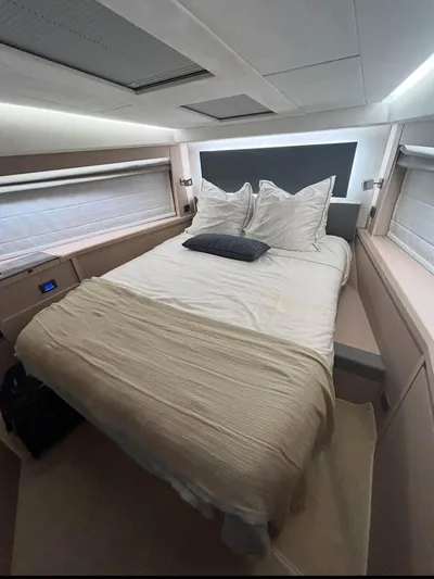  Yacht Photos Pics Luxurious bedroom interior of 2023 Prestige 520S yacht with modern design and cozy bedding.