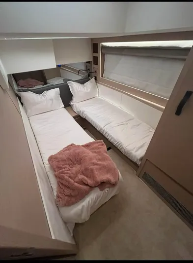  Yacht Photos Pics 2023 Prestige 520S yacht cabin with twin beds and cozy decor.