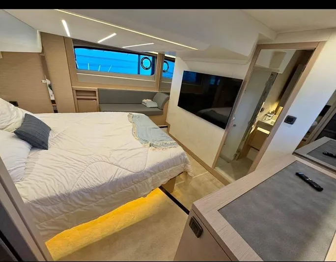  Yacht Photos Pics Luxurious bedroom interior of 2023 Prestige 520S yacht with modern amenities and elegant design.