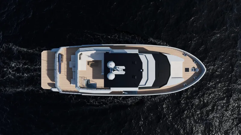  Yacht Photos Pics Top view of 2027 Custom Tufan and Brothers Mako Shark yacht on dark water.