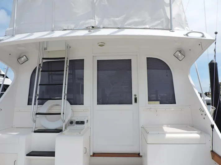  Yacht Photos Pics 1990 Post 44 Sport Fisherman boat stern with ladder and door.