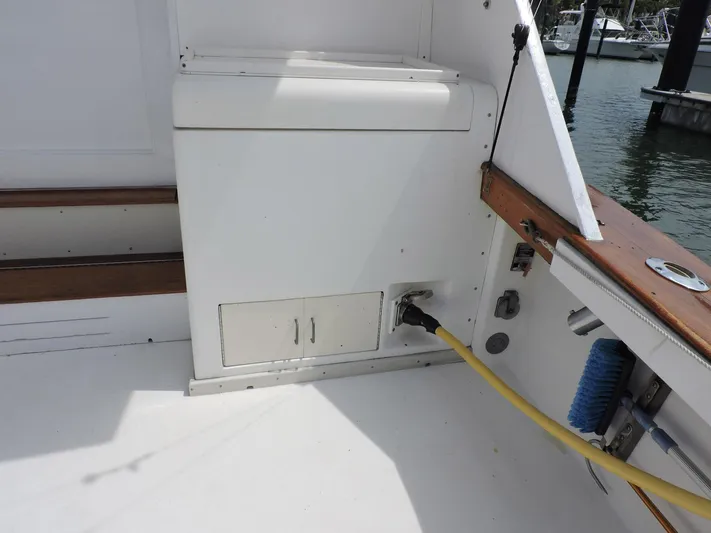  Yacht Photos Pics 1990 Post 44 Sport Fisherman boat deck with storage and utility connections.