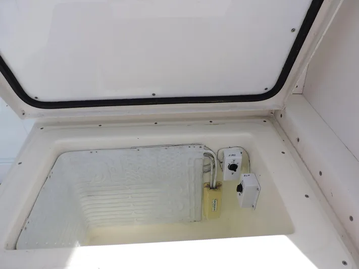  Yacht Photos Pics Open storage compartment on 1990 Post 44 Sport Fisherman boat.