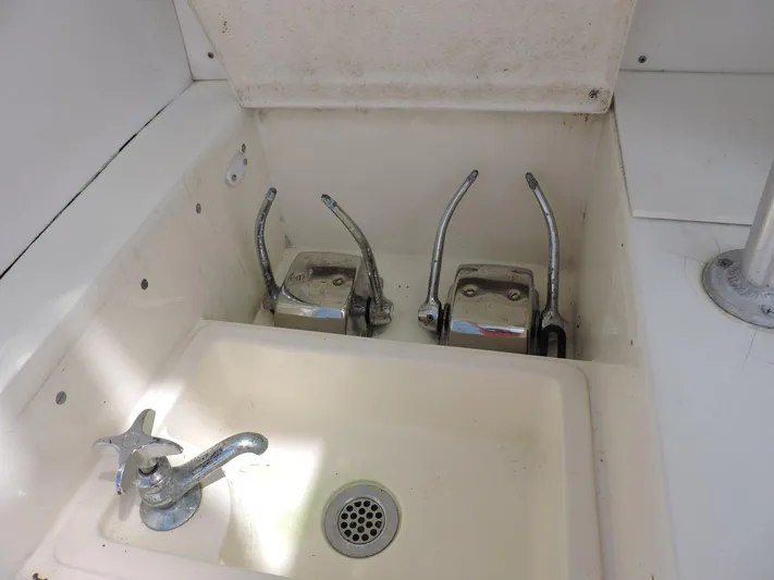  Yacht Photos Pics Sink and controls on a 1990 Post 44 Sport Fisherman boat.