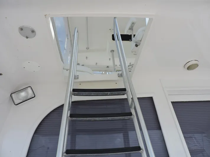  Yacht Photos Pics Ladder leading to upper deck on 1990 Post 44 Sport Fisherman boat.