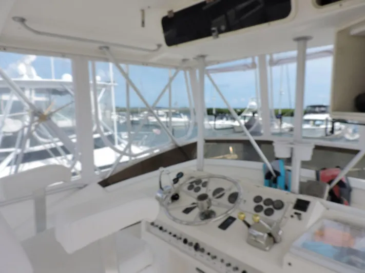  Yacht Photos Pics Interior view of 1990 Post 44 Sport Fisherman boat cockpit with steering controls.