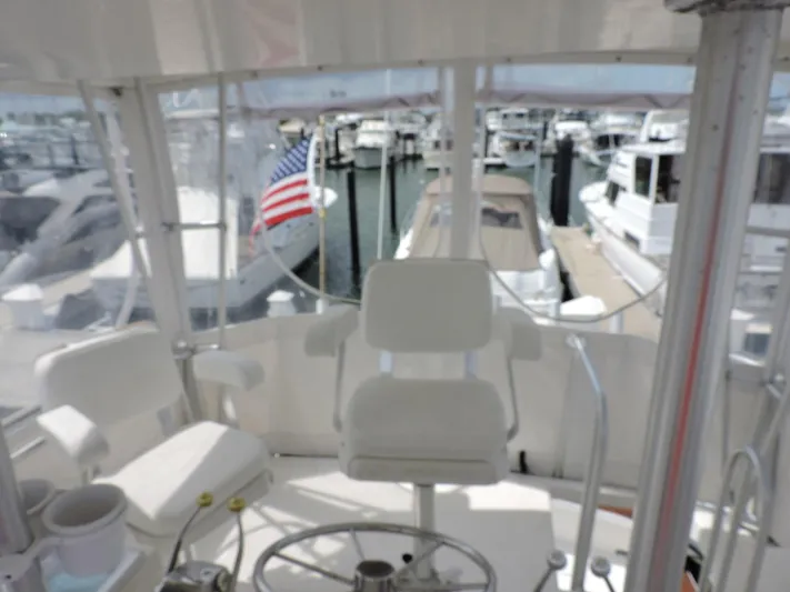  Yacht Photos Pics Cockpit view of 1990 Post 44 Sport Fisherman yacht in marina.