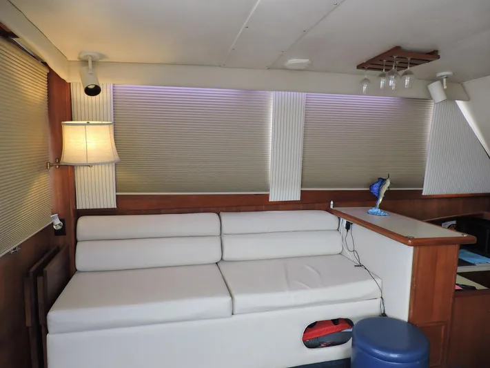  Yacht Photos Pics Interior of 1990 Post 44 Sport Fisherman with white sofa and wooden accents.