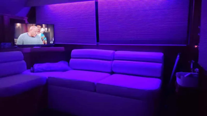  Yacht Photos Pics Luxurious interior of 1990 Post 44 Sport Fisherman with purple ambient lighting and TV.