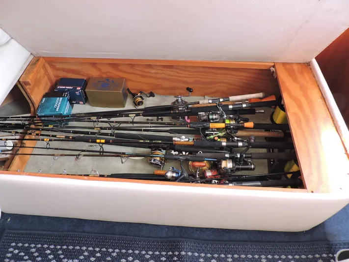  Yacht Photos Pics Fishing rods and gear stored in a compartment on a 1990 Post 44 Sport Fisherman boat.
