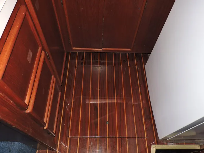  Yacht Photos Pics Interior of 1990 Post 44 Sport Fisherman with polished wood flooring and cabinetry.