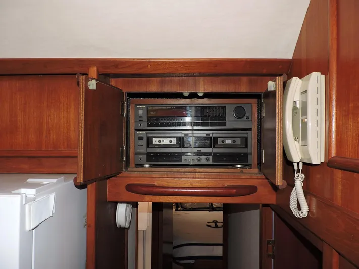  Yacht Photos Pics 1990 Post 44 Sport Fisherman interior with vintage stereo system and wall-mounted phone.