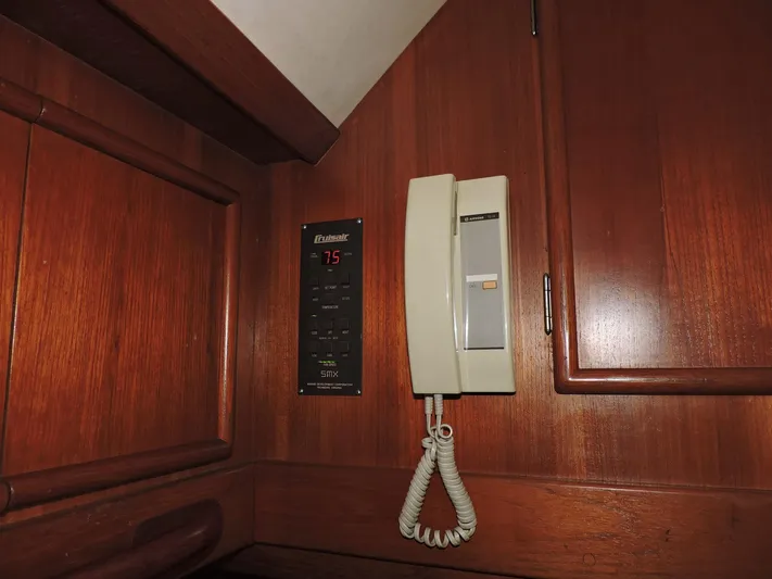  Yacht Photos Pics Wall-mounted phone and control panel on 1990 Post 44 Sport Fisherman yacht.