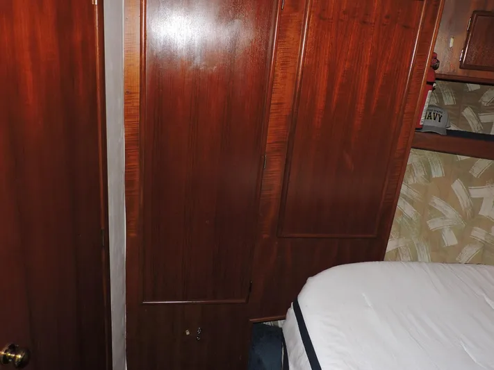  Yacht Photos Pics Interior of 1990 Post 44 Sport Fisherman with wooden cabinets and bed.
