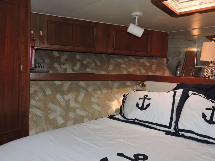  Yacht Photos Pics Cozy cabin interior of 1990 Post 44 Sport Fisherman with nautical-themed bedding.