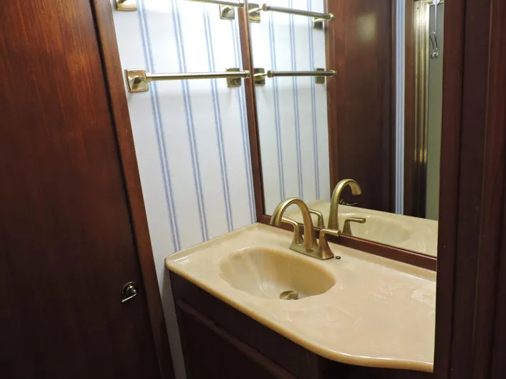  Yacht Photos Pics Bathroom vanity with gold faucet in 1990 Post 44 Sport Fisherman yacht.