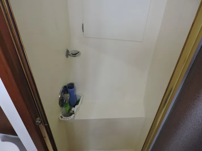  Yacht Photos Pics Shower area inside 1990 Post 44 Sport Fisherman boat, featuring a compact design.