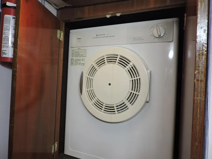  Yacht Photos Pics Compact dryer in wooden cabinet on 1990 Post 44 Sport Fisherman boat.