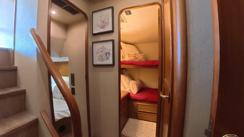 No Name Yacht Photos Pics Interior of 2002 Ocean Yachts 52 SUPER SPORT with cozy bunk beds and wooden accents.