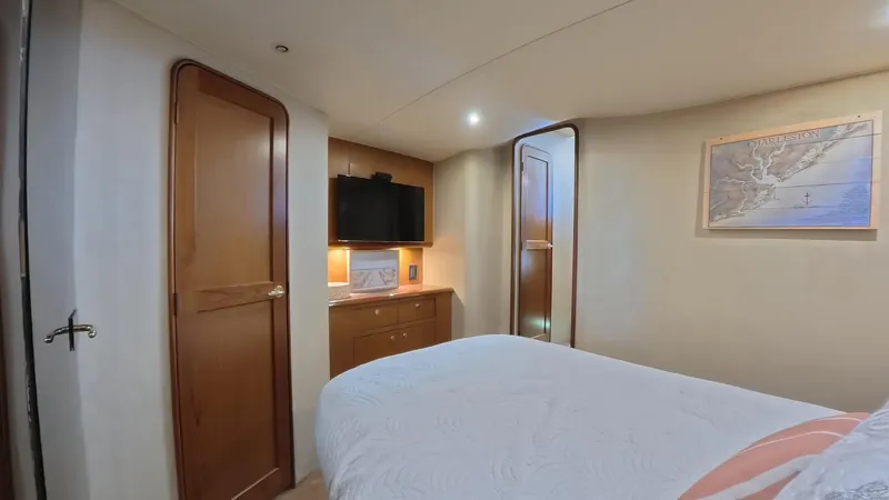 No Name Yacht Photos Pics Luxurious cabin interior of 2002 Ocean Yachts 52 SUPER SPORT with map and TV.