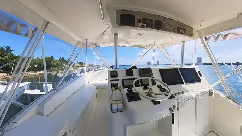 No Name Yacht Photos Pics Interior view of 2002 Ocean Yachts 52 SUPER SPORT helm with navigation equipment and ocean backdrop.