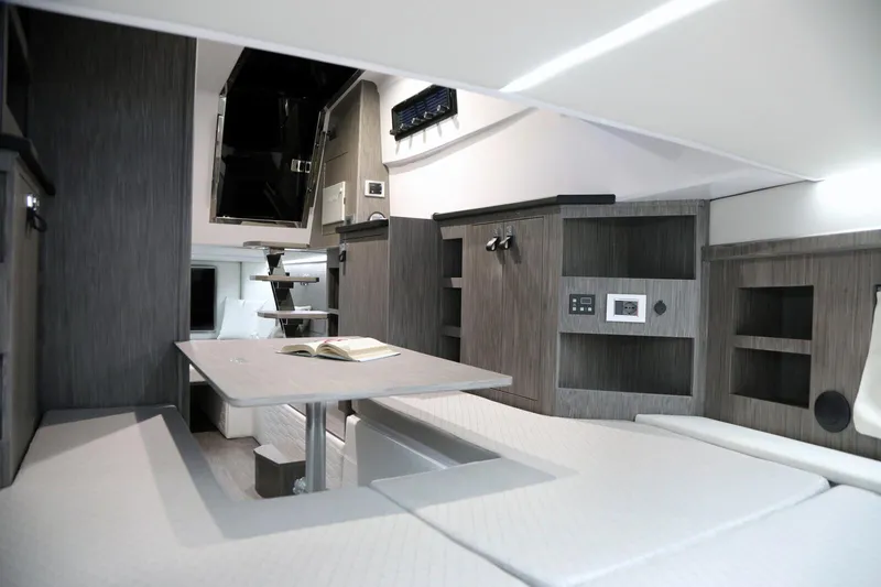  Yacht Photos Pics Interior of 2025 Ranieri CAYMAN 45.0 Cruiser, featuring modern seating and storage.