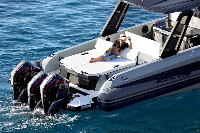  Yacht Photos Pics 2025 Ranieri CAYMAN 45.0 Cruiser on water, featuring triple outboard engines.