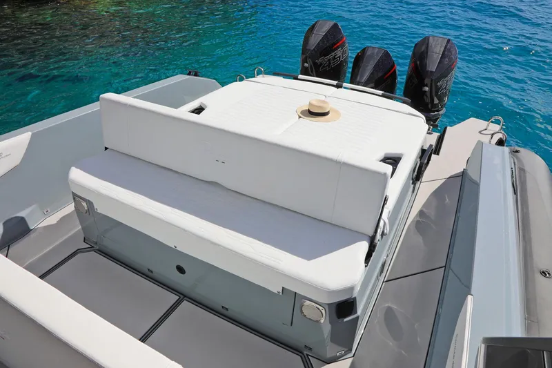  Yacht Photos Pics 2025 Ranieri CAYMAN 45.0 Cruiser with triple outboard engines on clear blue water.