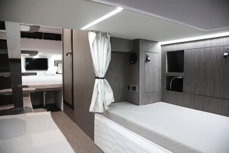  Yacht Photos Pics 2025 Ranieri CAYMAN 45.0 Cruiser interior with modern design and comfortable sleeping area.