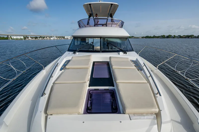 Pamper You Yacht Photos Pics 2019 Prestige 460 yacht with sunbathing deck on calm water.