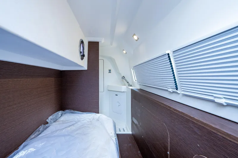 Pamper You Yacht Photos Pics Interior cabin of 2019 Prestige 460 yacht with bed and window blinds.