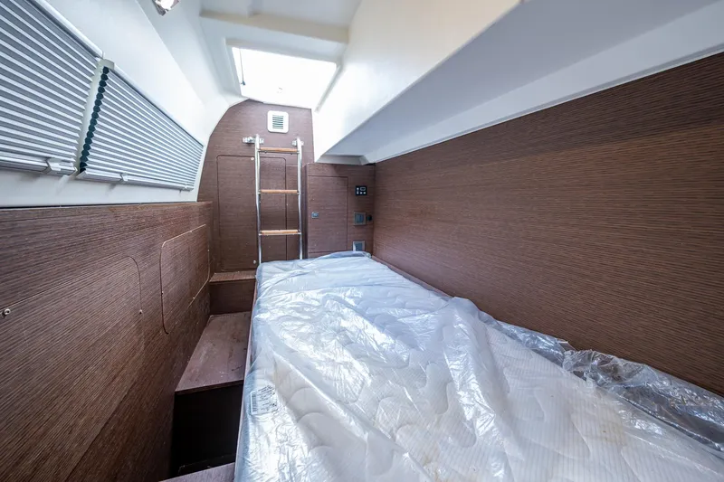 Pamper You Yacht Photos Pics 2019 Prestige 460 yacht interior cabin with wooden walls and a skylight.