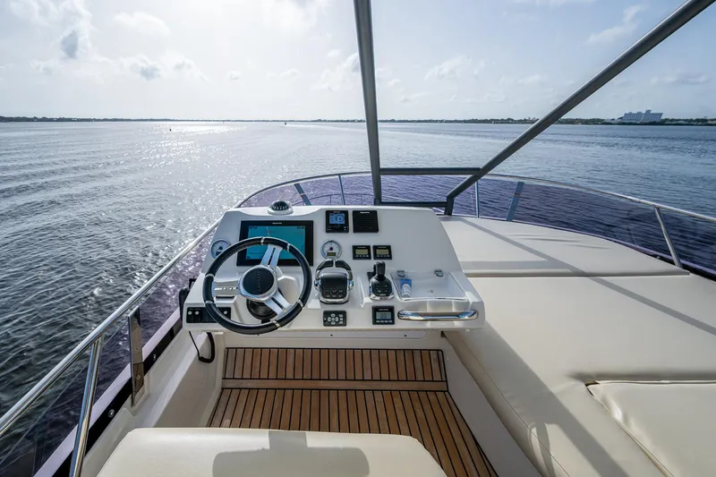Pamper You Yacht Photos Pics Prestige 460 yacht helm, 2019 model, with ocean view and modern controls.