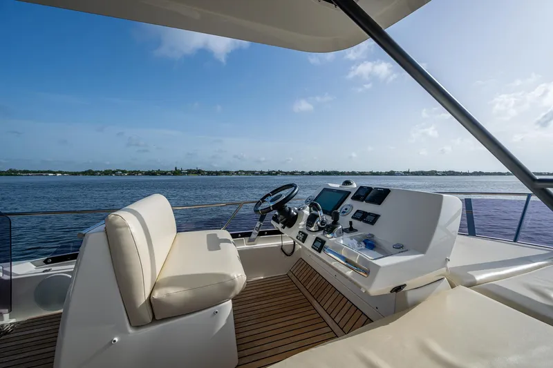 Pamper You Yacht Photos Pics Luxurious 2019 Prestige 460 yacht helm with scenic water view.