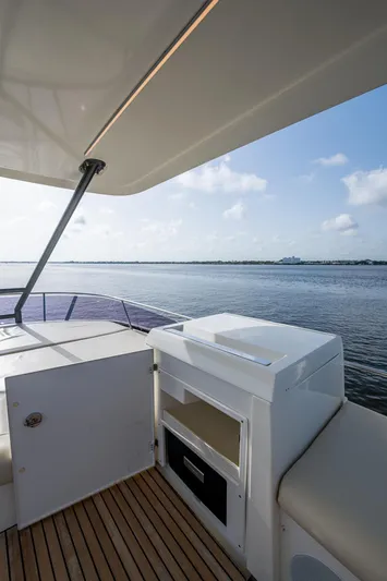 Pamper You Yacht Photos Pics Prestige 460 yacht deck, 2019 model, with ocean view and clear skies.