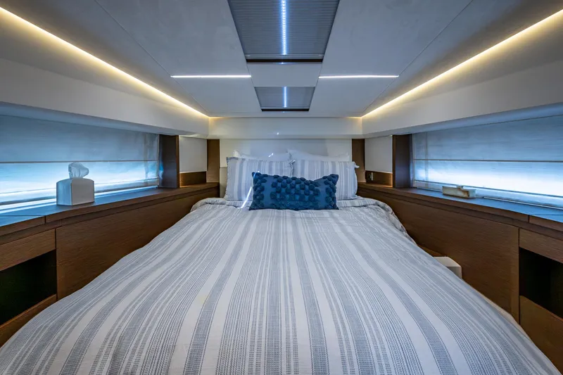 Pamper You Yacht Photos Pics Luxurious bedroom interior of a 2019 Prestige 460 yacht with modern lighting and decor.