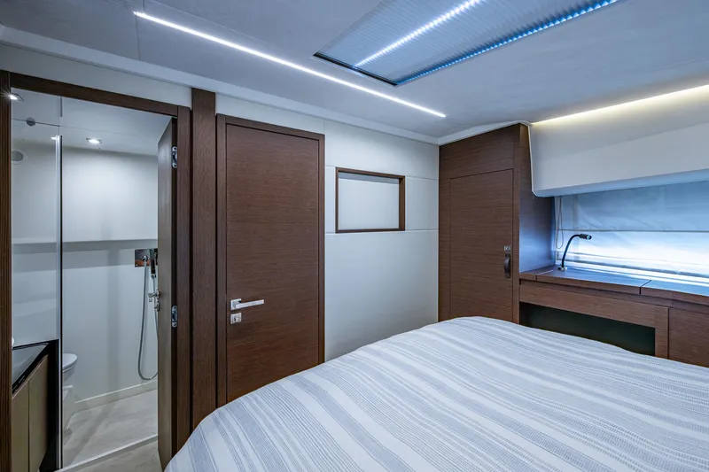 Pamper You Yacht Photos Pics Luxurious interior of 2019 Prestige 460 yacht cabin with modern design and elegant wood finishes.