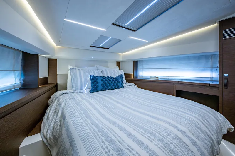 Pamper You Yacht Photos Pics Luxurious bedroom interior of 2019 Prestige 460 yacht with modern lighting and cozy bedding.