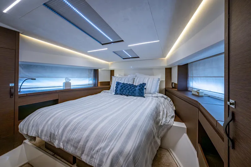 Pamper You Yacht Photos Pics Luxurious bedroom interior of 2019 Prestige 460 yacht with modern design and ambient lighting.
